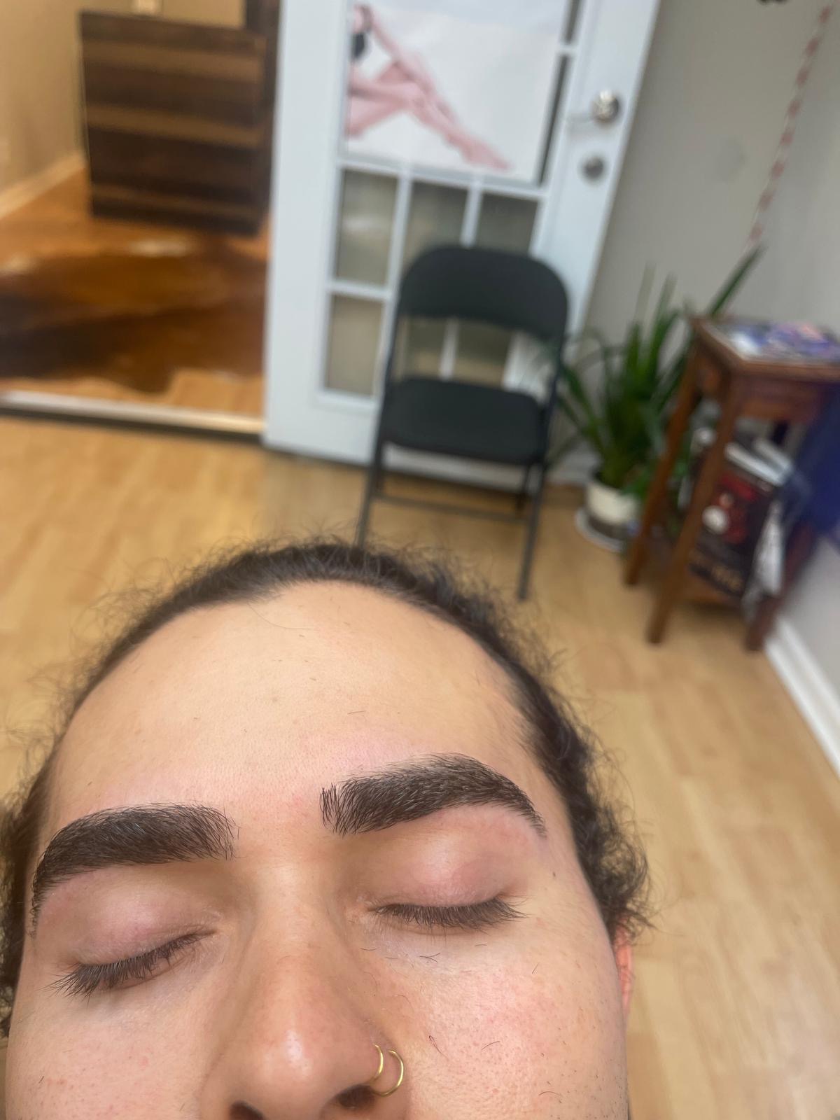 Full natural brows cleaned up and defined with threading