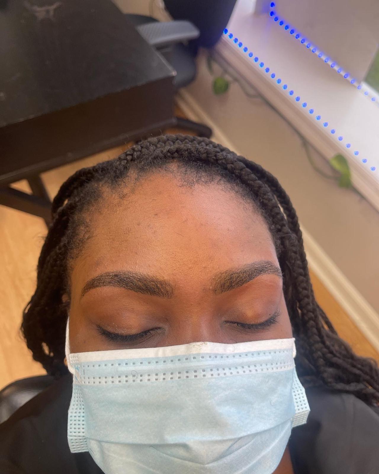 Precisely shaped and tinted eyebrows with clean symmetry