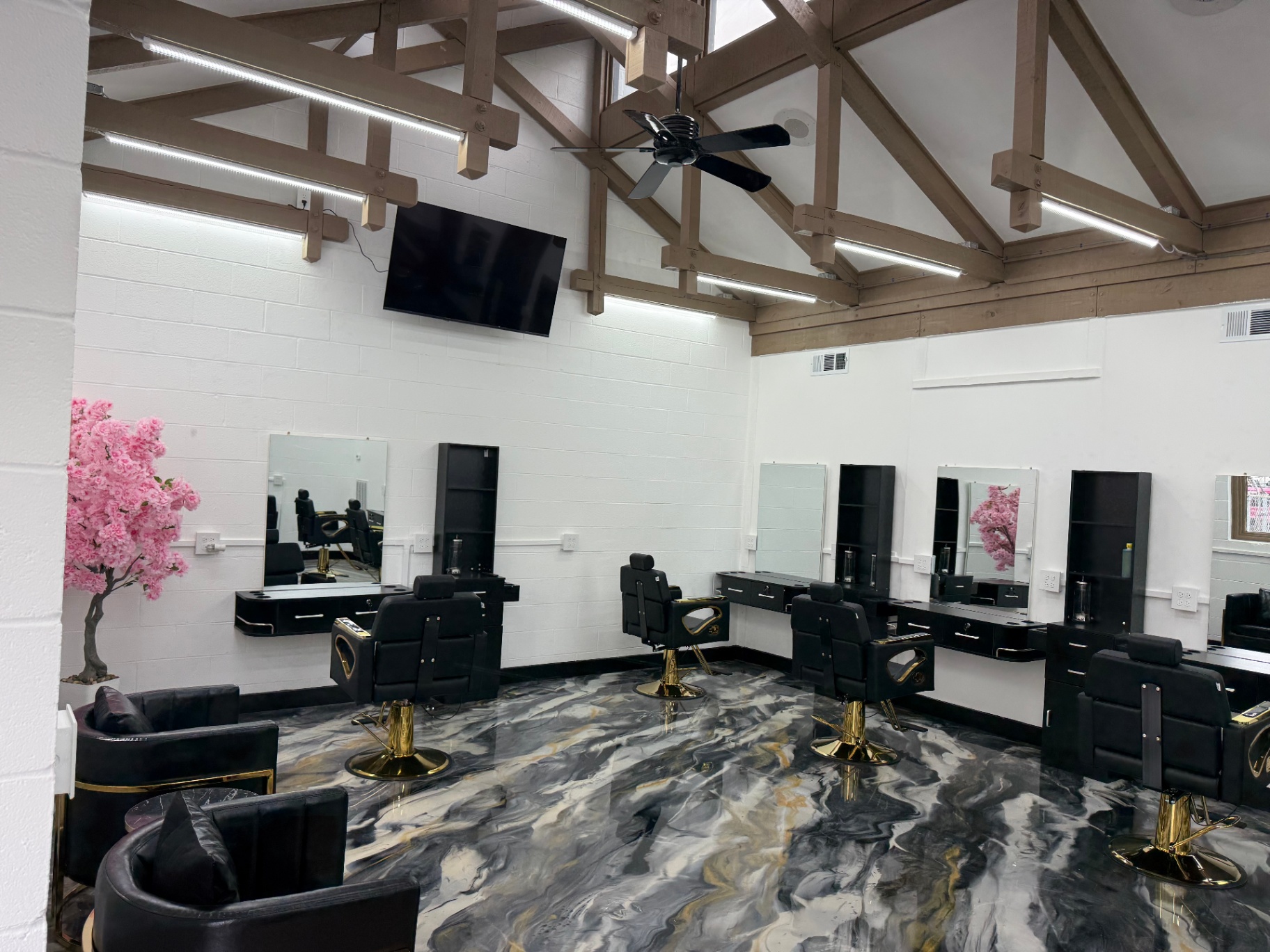 Seating area with cherry blossom accent inside the salon