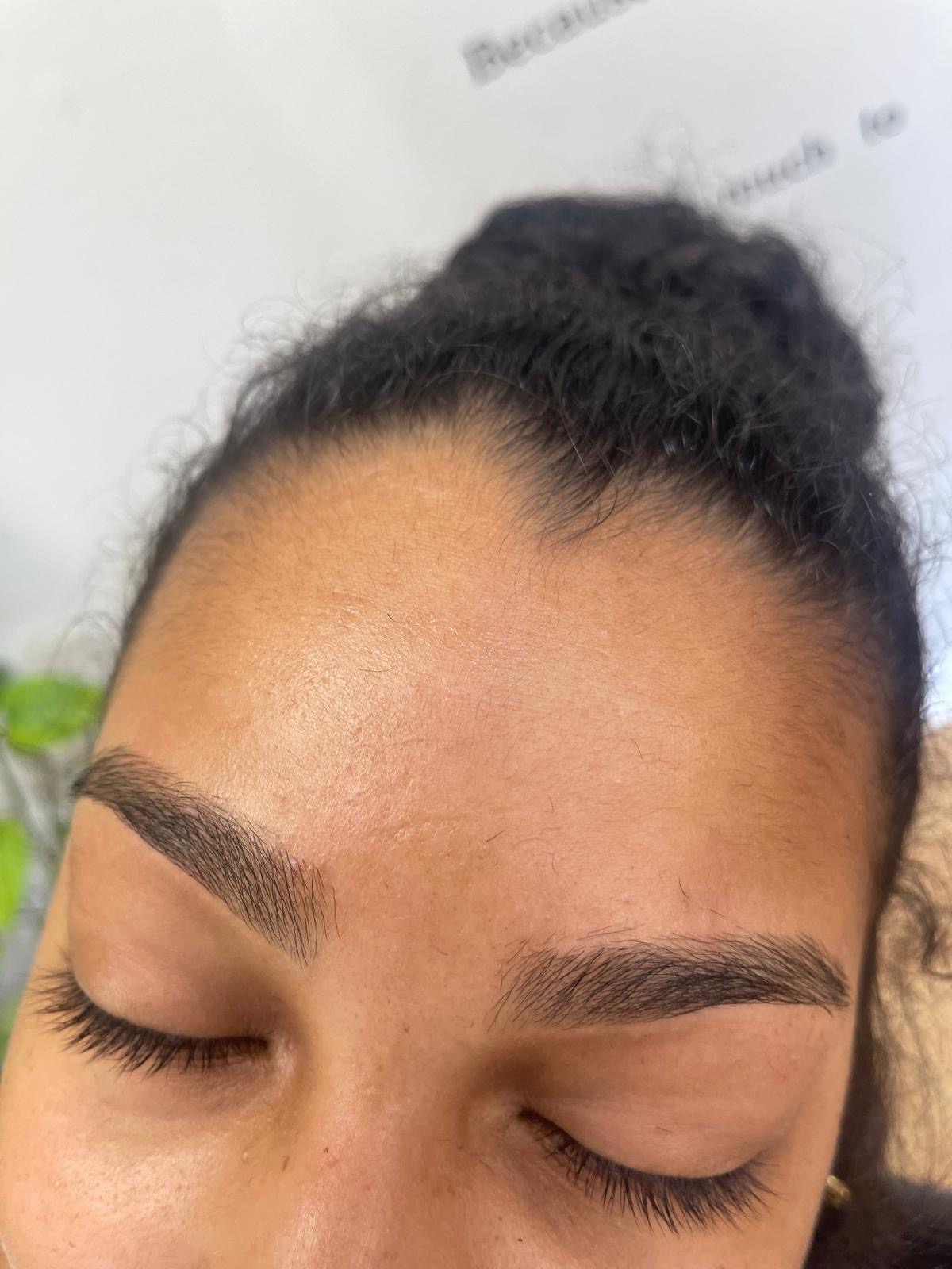 Feathered brow shaping with soft edges and even symmetry
